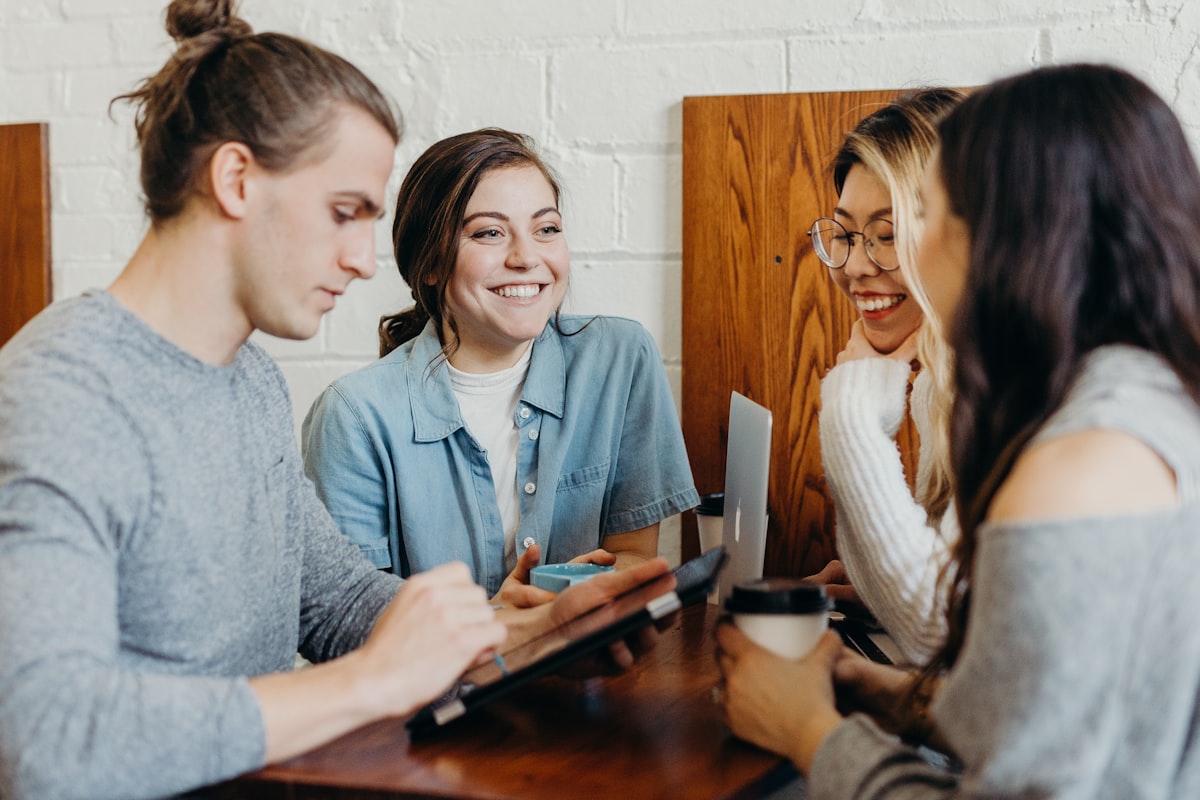 Friends talking warmly around a table